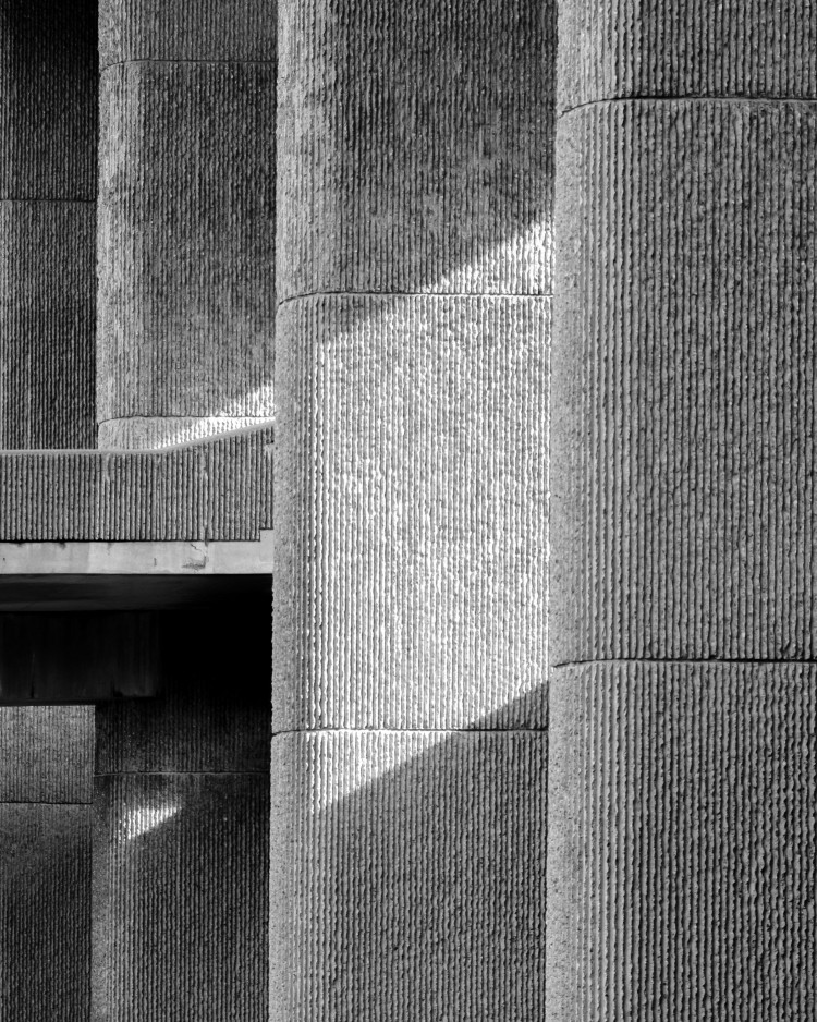 A brutalist style concrete building close up. The building is the Massachusetts General Hospital.